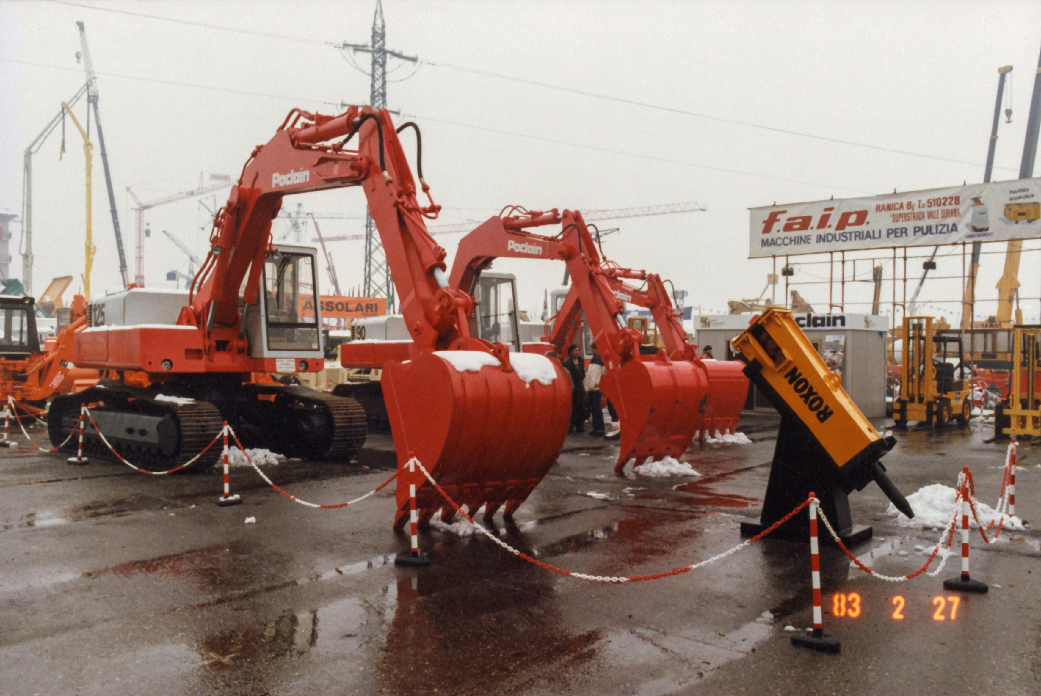 Red Poclain excavators on display